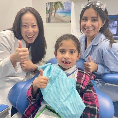 All smiles: Doc, Assistant & Patient.