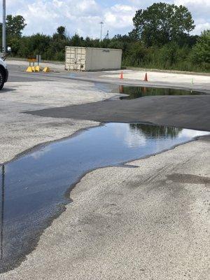 Dropped container in parking spot???