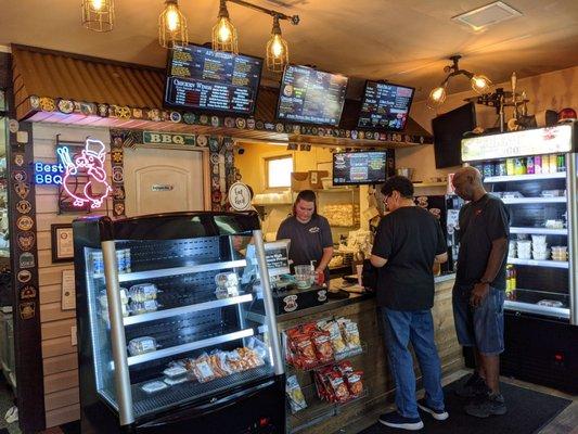 Cashier counter is neat and organized. But menus are everywhere takes some time to read