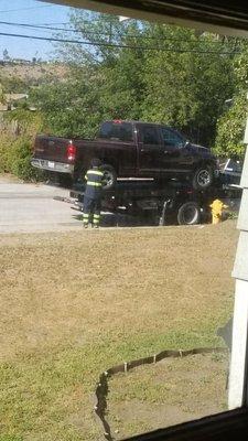 Donald loading our truck onto the flatbed.