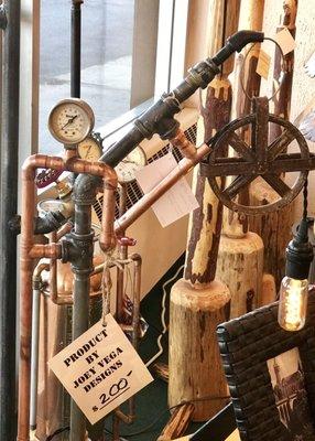 A variety of price points on the Joey Vega steam punk art at Statewide Lighting.