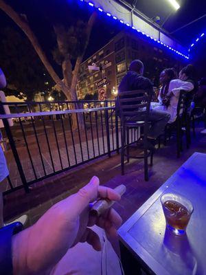 outdoor patio with a bustling downtown crowd.