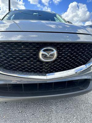 Front bumper damage to CX30