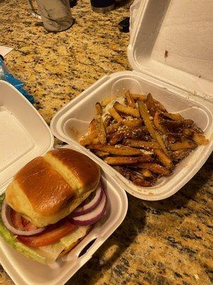 Fries and burger patty packed together , burger condiments on the side. Nice!