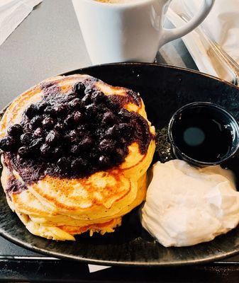 Lemon ricotta pancakes smothered in blueberries