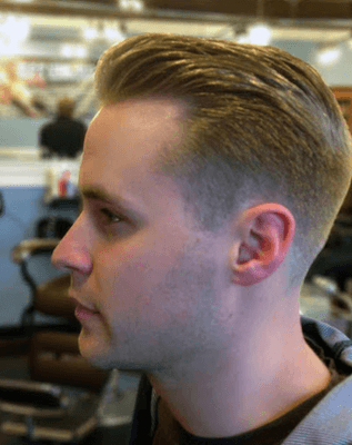 Men's short clipper cut.