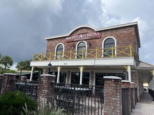 Outside facade and patio seating.