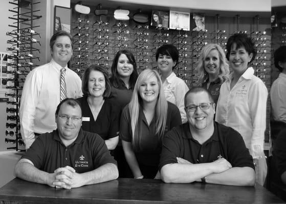 In white L-R: Dr. Brinegar, Dr.Brinegar, Dr. DeFeo. Staff: front row: Jim, Brad, row 2: Sandra, Katie; row 3: Nicole, Denise