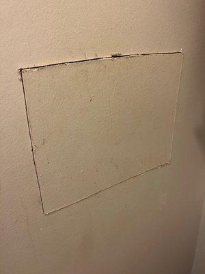 Hole in wall from fixing a pipe. Never fixed this hole