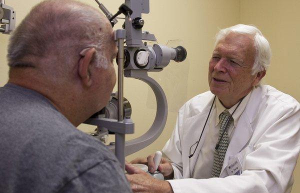 Dr. Robert Young with a patient