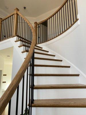 New newel posts, handrails, and balusters, and replaced bottom tread and 1 other tread...LOVE IT!