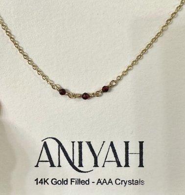 14k Gold filled with Garnet colored AAA Crystals.