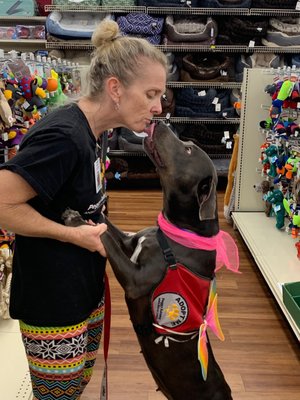 Adoption event with the shelter getting a thank you kiss from the pups for taking them out for the day.