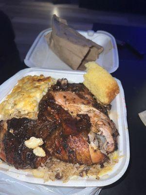 Large jerk chicken comes with rice,cabbage and Mac and cornbread $15 can feed 2! Everything was so good and the service was good and quick