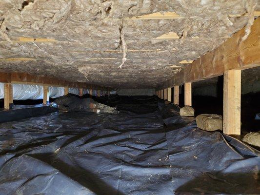 Rodent damaged and flooded crawl space being repaired