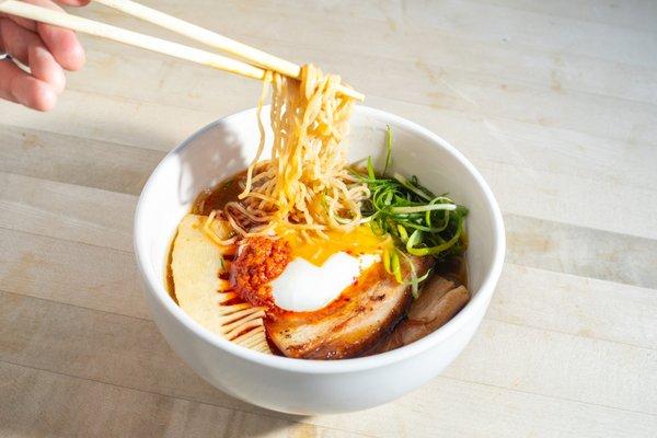 Smoked Pork Ramen with pork belly, a poached egg, and bamboo.