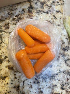 7 tiny carrots - white film. Gross.