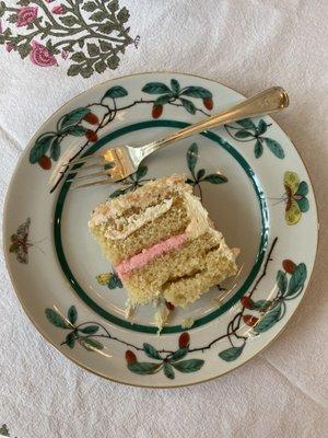 Vanilla baptism cake with strawberry filling.