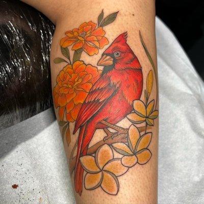 Neotraditional cardinal and flowers calf tattoo.