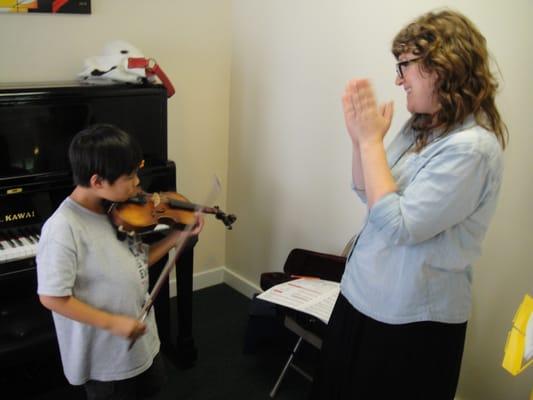 Here is Chloe, our violin instructor, with her student.