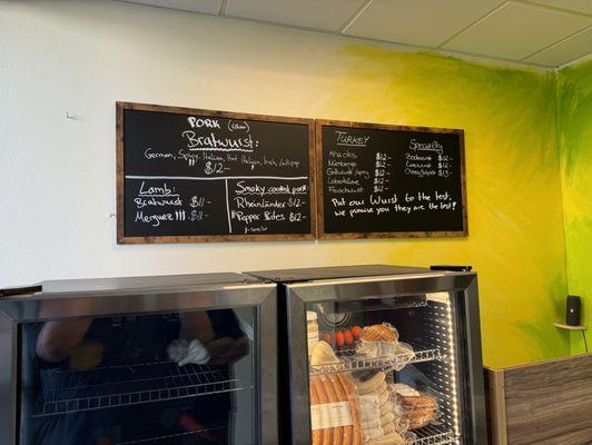 Menu on the wall. Prices look different than the one on the counter