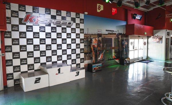 Take a picture of your group at our podium and check out the authentic motorsport memorabilia on display!