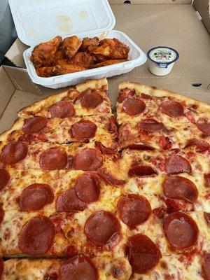 Large pizza with pepperoni and roasted red peppers and an order of hot wings