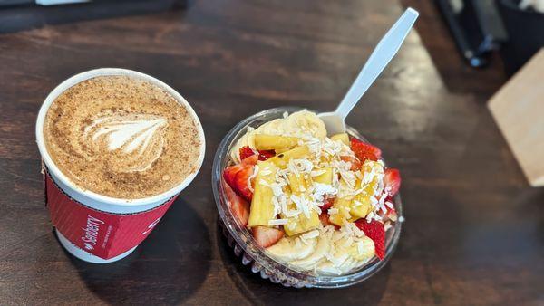 Tropicial Acai: Acaì topped with granola, strawberry, banana, pineapple, coconut flakes, raw honey  Honey Cinnamon Latte