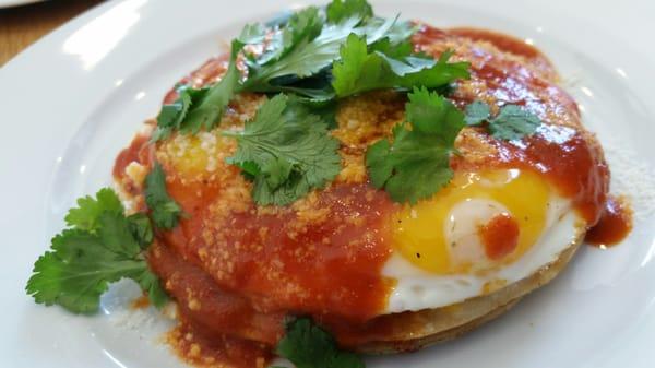 Breakfast quesadilla stack- four tortillas layered with cheddar,  2 sunny side up eggs, spicy tomato sauce, & cilantro. Nice!