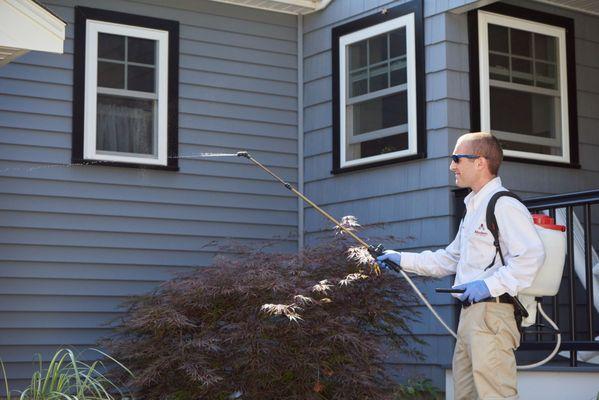 Service professional providing exterior home service