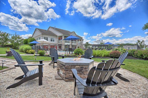 Fire pit overlooking the pool and clubhouse