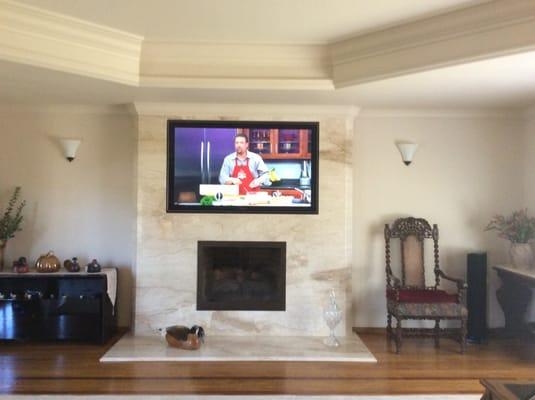 Marble fireplace wall with TV