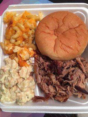 Pork dinner plate with mac and cheese and potato salad. YUMMY