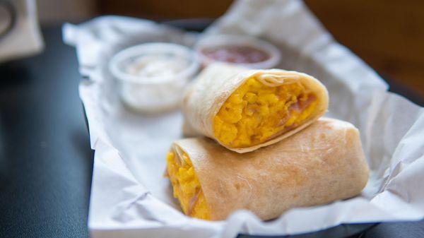 Breakfast burrito! A different assortment of meat, and cheese available. Served with salsa or sour cream.