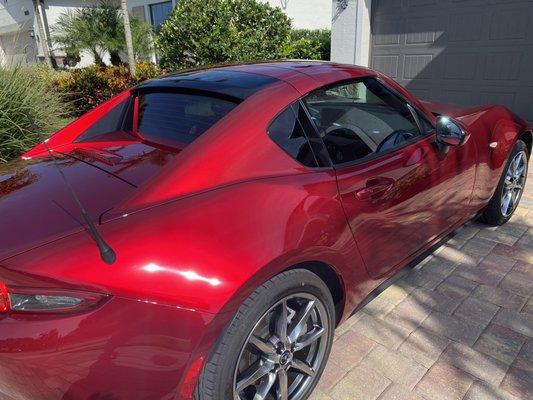 Rear end shot. The entire car is just amazing. The paint correction and ceramic coating really made this cherry red pop!