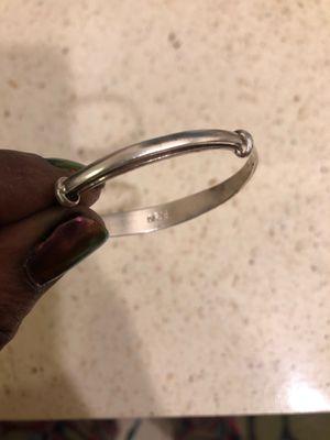 "Silver" bracelet. It's made of tin.