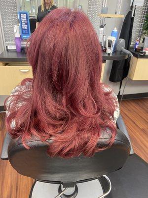 Bombshell red with sleek blowout