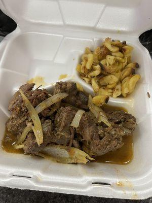 Stewed Goat (Chivo Guisado) w/ fried macaroni and cheese (macaroni Au Gratin) and fried plantains were the second side