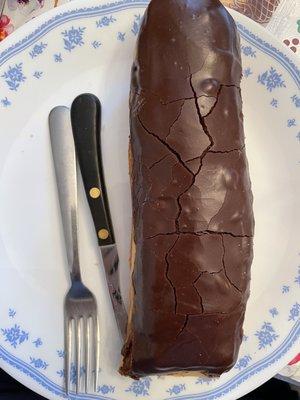 Chocolate custard long John. Normal sized fork.