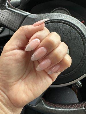 Almond shape, gel pink base with silver French tips with Ni