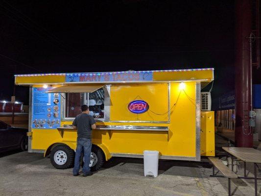 Bright yellow food truck. Can't miss it