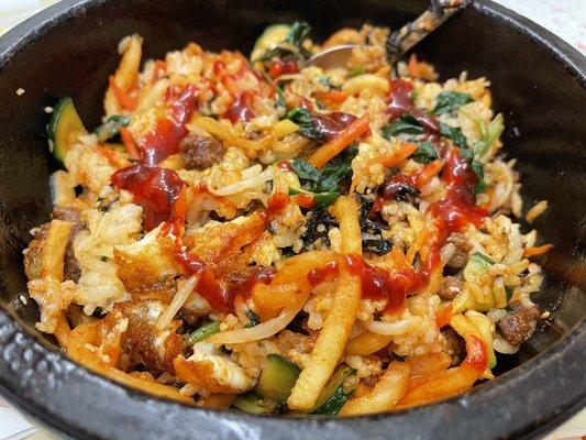 Hot sizzling stone pot  bibimbap with kogujaung sauce...