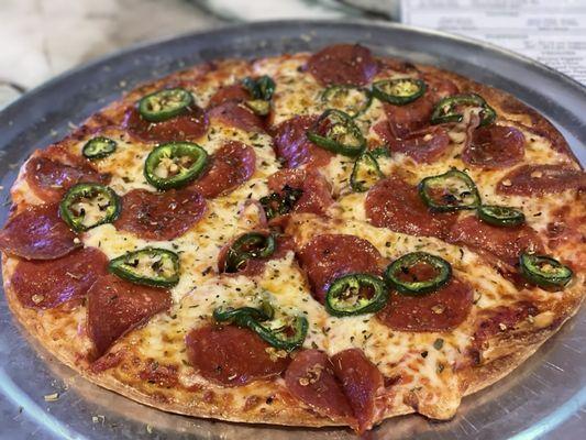 The Guadalupe - classic American pie - pizza sauce - garlic- pepperoni-Mozzarella- another layer of pepperoni and jalapeños!