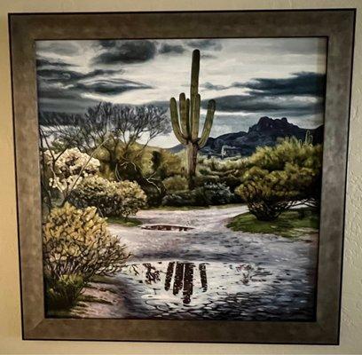 Desert scene with a metal and wood frame