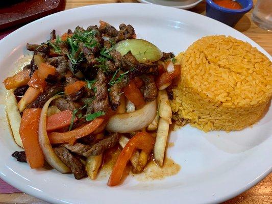 Lomo Saltado with Mexican rice by choice, it's usually served with white rice