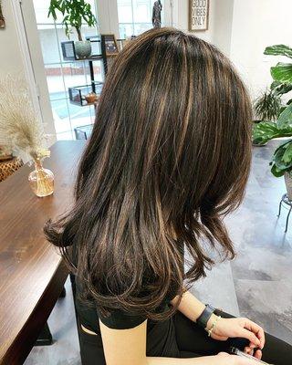 Adding a warm tone to her deep brown hair  just adds that little glimmer and softness.