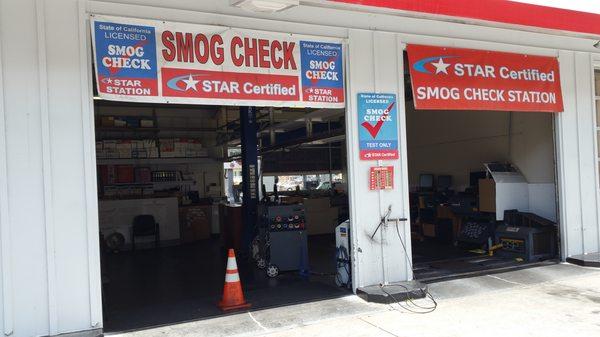 Smog shop entrance is located at/ behind the Valero gas station