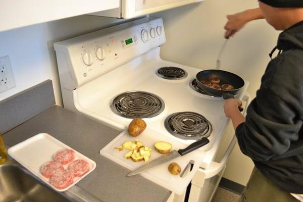 making breakfast in the kitchen