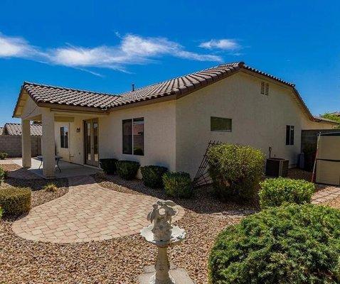 Henderson single-family residence. Finished backyard with they have two water fountains and covered patio