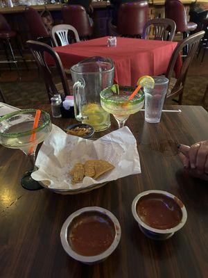 Chips and salsa and empty pitcher of margaritas